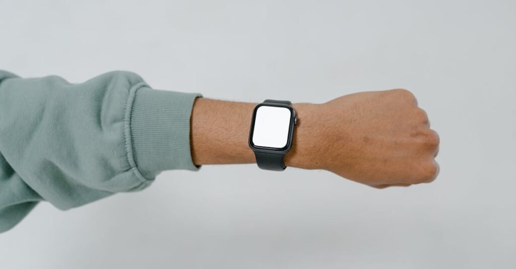 A close-up view of a smartwatch with blank screen on an adult's wrist, ideal for mockup designs.
